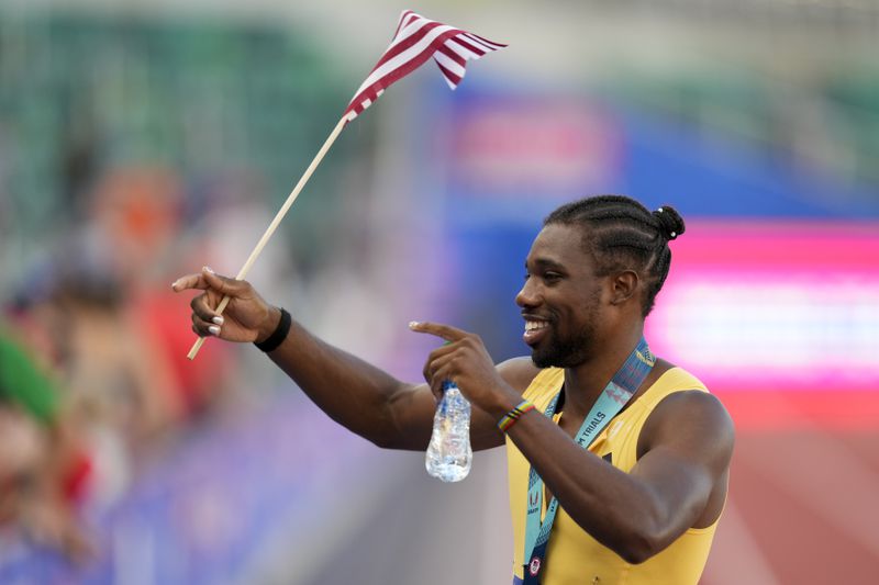 Noah Lyles celebrates after winning the men's 200-meter final during the U.S. Track and Field Olympic Team Trials Saturday, June 29, 2024, in Eugene, Ore. (AP Photo/Charlie Neibergall)