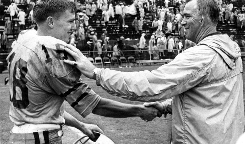 University of Florida coach Ray Graves (right) congratulates Georgia Tech's Billy Lothridge after the Yellow Jackets quarterback helped defeat the Graves-coached Gators in a game in the early 1960s. (Joe McTyre/AJC file photo)