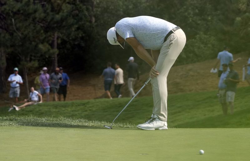 Keegan Bradley reacts after missing a putt on 17th green during the second round of the BMW Championship golf event at Castle Pines Golf Club, Friday, Aug. 23, 2024, in Castle Rock, Colo. (AP Photo/Matt York)