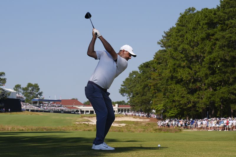 Scottie Scheffler hits his tee shot on the 18th hole during the second round of the U.S. Open golf tournament Friday, June 14, 2024, in Pinehurst, N.C. (AP Photo/Frank Franklin II)