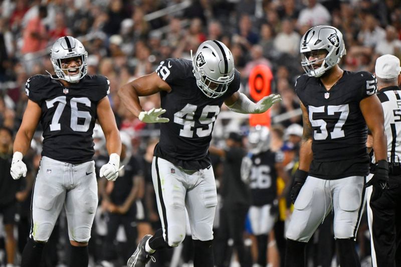 Las Vegas Raiders defensive end Charles Snowden (49) reacts after a sack against the San Francisco 49ers during the first half of an NFL preseason football game, Friday, Aug. 23, 2024, in Las Vegas. (AP Photo/David Becker)