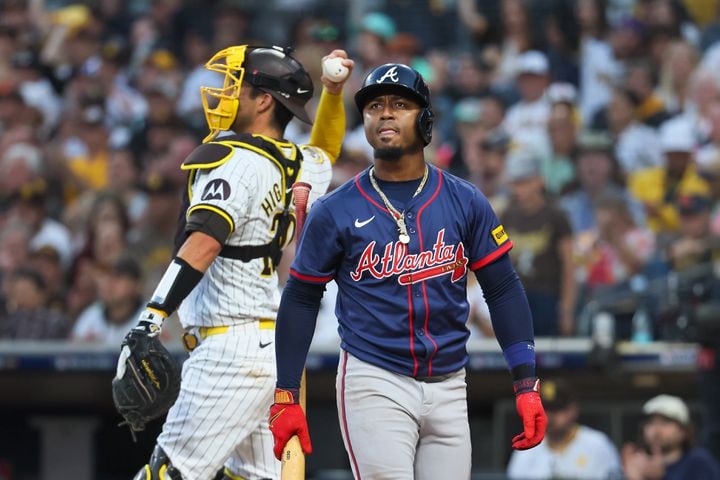 Atlanta Braves’ Ozzie Albies strikes out against the San Diego Padres and catcher Kyle Higashioka, left, during the third inning of National League Division Series Wild Card Game One at Petco Park in San Diego on Tuesday, Oct. 1, 2024.   (Jason Getz / Jason.Getz@ajc.com)