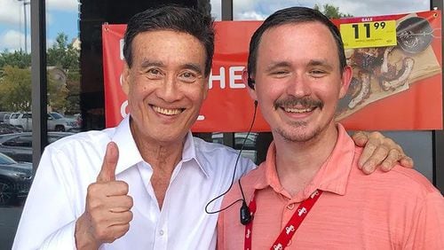 Robert Kim with James Whitten, who used to be the store manager at the Cherokee Plaza Kroger. (Photo provided by Robert Kim)