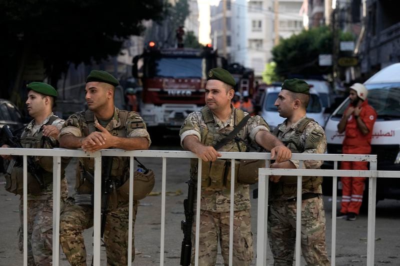 Lebanese soldiers secure the area a day after an Israeli missile strike in Beirut's southern suburbs, Saturday, Sept. 21, 2024. (AP Photo/Bilal Hussein)