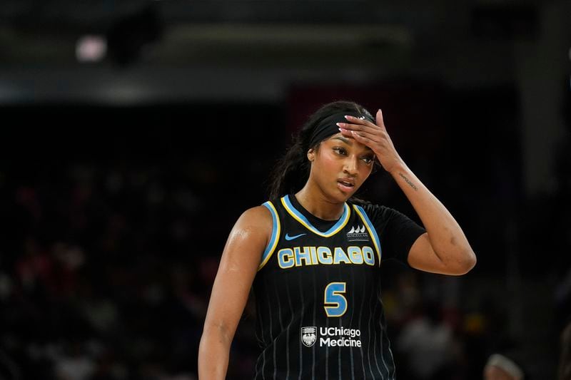 Chicago Sky forward Angel Reese wipes her brow during the first half of a WNBA basketball game against the Indiana Fever, Friday, Aug. 30, 2024, in Chicago. (AP Photo/Erin Hooley)