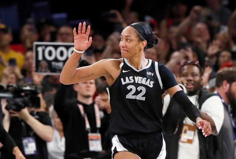 Las Vegas Aces center A'ja Wilson (22) celebrates during the second half of an WNBA basketball game against the Connecticut Sun Sunday, Sept. 15, 2024, in Las Vegas.(Steve Marcus/Las Vegas Sun via AP)