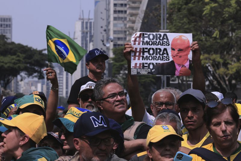 Demonstrators take part in a protest calling for the impeachment of Supreme Court Minister Alexandre de Moraes, who recently imposed a nationwide block on Elon Musk’s social media platform X, in Sao Paulo, Saturday, Sept. 7, 2024. (AP Photo/Ettore Chiereguini)