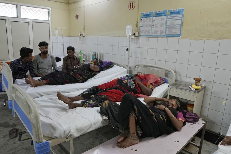 People injured in a stampede receive treatment at Hathras district hospital, Uttar Pradesh, India, Wednesday, July 3, 2024. Thousands of people at a religious gathering rushed to leave a makeshift tent, setting off a stampede Tuesday that killed more than hundred people and injured scores. (AP Photo/Rajesh Kumar Singh)