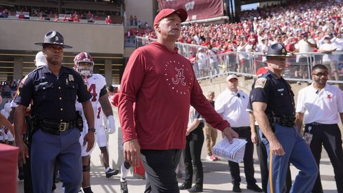 Alabama head coach Kalen DeBoer leads his team on the field before an NCAA college football game against Wisconsin Saturday, Sept. 14, 2024, in Madison, Wis. (AP Photo/Morry Gash)