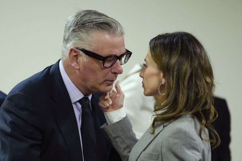 Hilaria Baldwin speaks to her husband, actor Alec Baldwin, during his trial for involuntary manslaughter for the 2021 fatal shooting of cinematographer Halyna Hutchins during filming of the Western movie "Rust," Friday, July 12, 2024, at Santa Fe County District Court in Santa Fe, N.M. (Ramsay de Give/Pool Photo via AP)