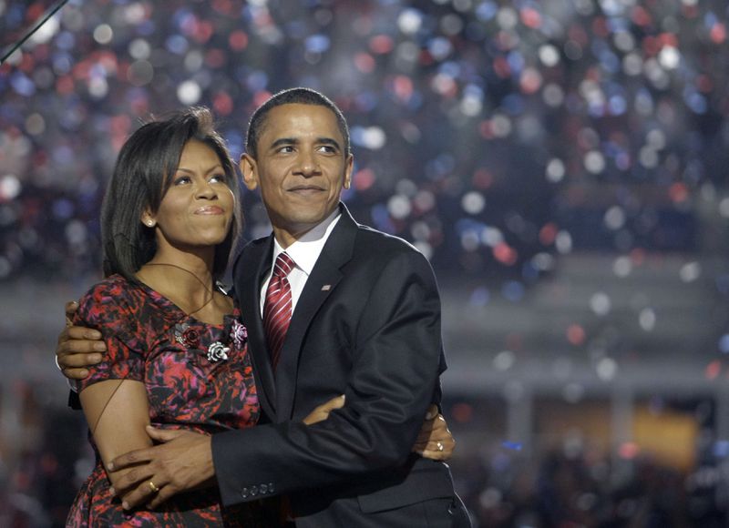 FILE - Democratic presidential candidate, Sen. Barack Obama, D-Ill., hugs his wife, Michelle Obama, after giving his acceptance speech at the Democratic National Convention at Invesco Field at Mile High in Denver, Aug. 28, 2008.(AP Photo/Alex Brandon, File)