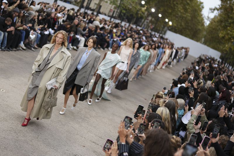 Models wear creations as part of the Stella McCartney Spring/Summer 2025 collection presented Monday, Sept. 30, 2024 in Paris. (Photo by Scott A Garfitt/Invision/AP)