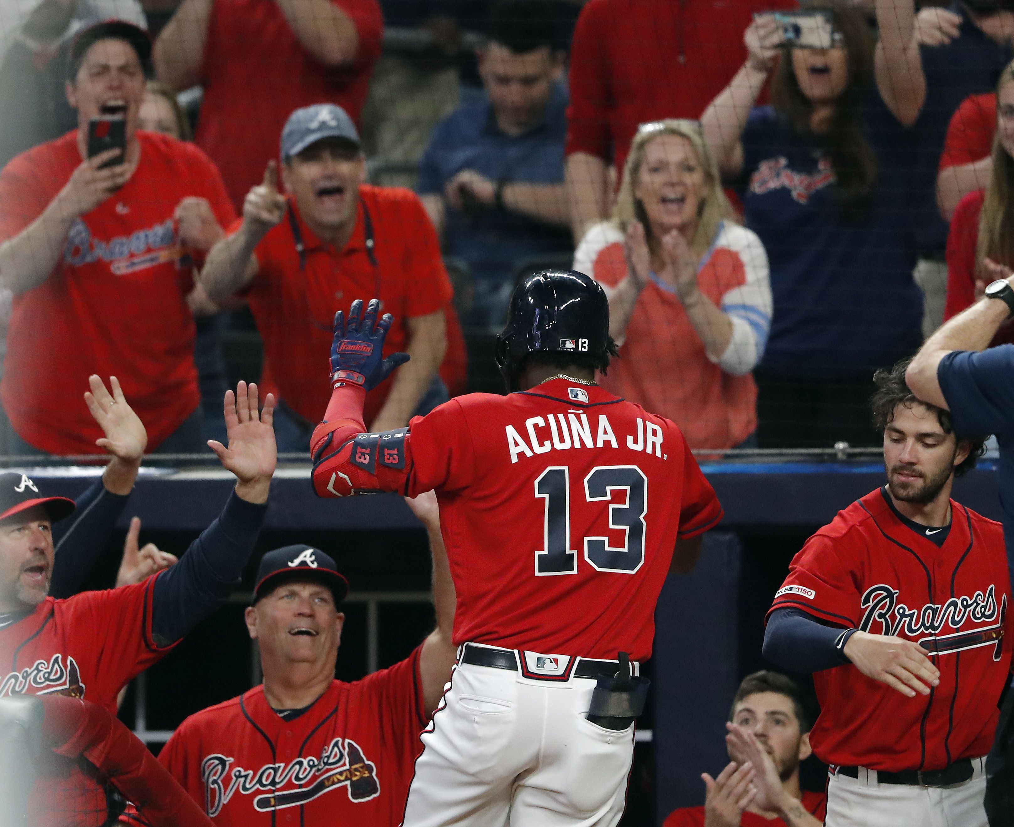 Photos: Braves break out red uniforms, beat Marlins