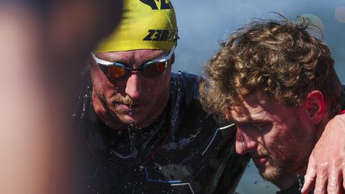 Carson Clough, of the United States, prepares for the cycling portion of the PTS4 Triathlon at the 2024 Paralympics, Monday, Sept. 2, 2024 in Paris, France. (AP Photo/Caleb Craig)