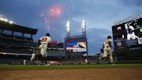 Braves right fielder Ronald Acuña Jr. and centerfielder Michael Harris II jumps into the field before the beginning of the game against the Chicago Cubs at Truist Park on Wednesday, Sep. 27, 2023, in Atlanta.  Miguel Martinez / miguel.martinezjimenez@ajc.com 