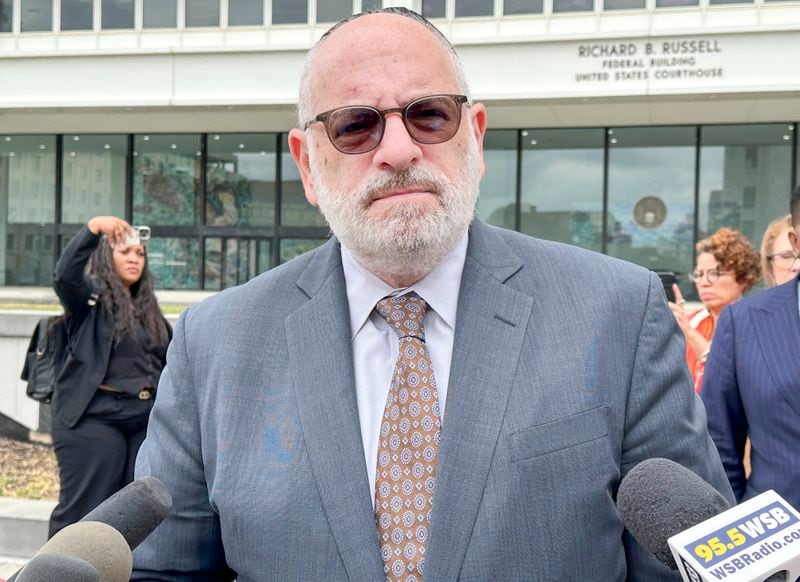 Ronald Coleman, an attorney representing former President Donald Trump and his campaign, addresses reporters outside a federal courthouse in Atlanta on Sept. 3, 2024, after a judge ruled that Trump and his campaign must stop using the song “Hold On, I’m Coming.” (AP Photo/Kate Brumback)