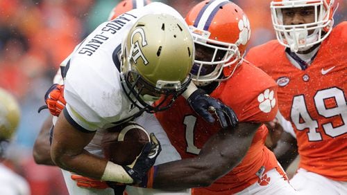 CLEMSON, SC - OCTOBER 10: Mikell Lands-Davis #37 of the Georgia Tech Yellow Jackets is tackled by Jayron Kearse #1 of the Clemson Tigers during their game at Memorial Stadium on October 10, 2015 in Clemson, South Carolina. (Photo by Tyler Smith/Getty Images)