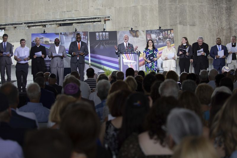 Rabbi Jeffrey Myers, center, Tree of Life congregation and 10/27 survivor, leads an interfaith blessing during the groundbreaking ceremony for the new Tree of Life complex in Pittsburgh, Sunday, June 23, 2024. The new structure is replacing the Tree of Life synagogue where 11 worshipers were murdered in 2018 in the deadliest act of antisemitism in U.S. history. (AP Photo/Rebecca Droke)