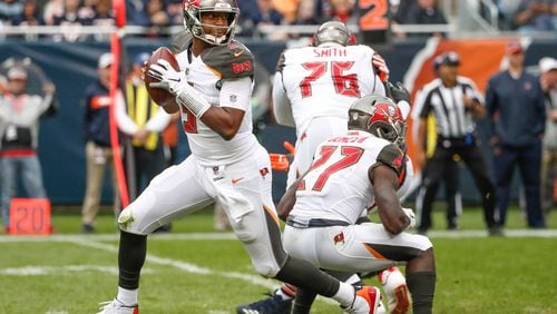 Tampa Bay Buccaneers quarterback Jameis Winston (3) looks to pass the ball against the Chicago Bears during the second half at Soldier Field.