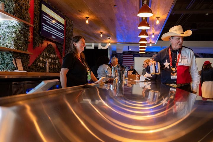 An attendee orders a drink at Fiserv Form in Milwaukee on Thursday, July 18, 2024, the fourth day of the Republican National Convention (Arvin Temkar / AJC)