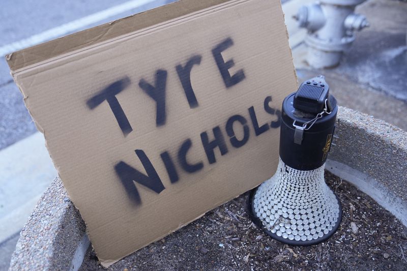 A sign is seen outside the federal courthouse during the trial of three former Memphis police officers charged in the 2023 fatal beating of Tyre Nichols, Thursday, Oct. 3, 2024, in Memphis, Tenn. (AP Photo/George Walker IV)