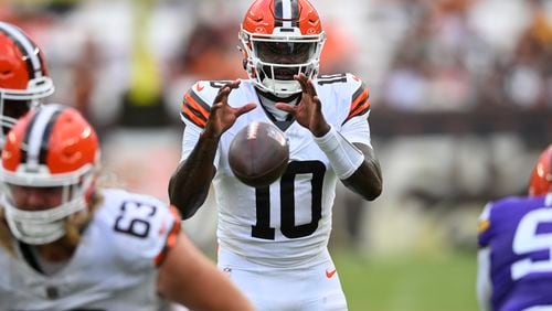 Cleveland Browns quarterback Tyler Huntley (10) takes the snap against the Minnesota Vikings during the second half of an NFL preseason football game, Saturday, Aug. 17, 2024, in Cleveland. (AP Photo/David Richard)