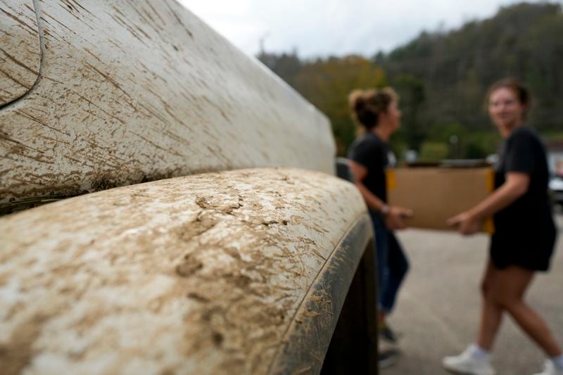 Volunteers unload supplies at a relief center on Thursday, Oct. 3, 2024, in Vilas, N.C. in the aftermath of hurricane Helene. In the final weeks of the presidential election, people in North Carolina and Georgia, influential swing states, are dealing with more immediate concerns: recovering from Hurricane Helene. (AP Photo/Chris Carlson)