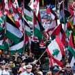 People march on the street as Pro-Palestinian supporters rally in Sydney, Sunday, Oct. 6, 2024. (AP Photo/Rick Rycroft)