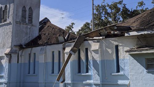 This photo provided by the Orlando Fire Department shows damage to the Black Bottom House of Prayer in Orlando after the roof collapsed. No one was injured.