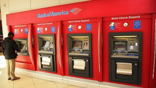 NEW YORK, NY - APRIL 16: A man uses an ATM at a Bank of America branch on April 16, 2014 in New York City. (Photo by Spencer Platt/Getty Images)