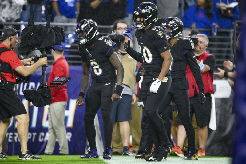 Baltimore Ravens quarterback Lamar Jackson (8) reacts onto a camera operator after scoring on a run against the Buffalo Bills during the second half of an NFL football game, Sunday, Sept. 29, 2024, in Baltimore. (AP Photo/Nick Wass)