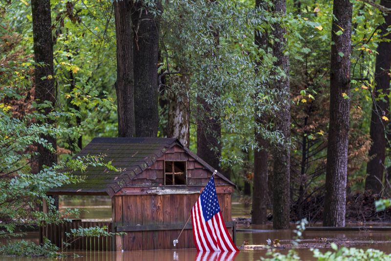 Floodwaters surround a structure Wednesday, Sept 27, 2024, in Atlanta. (AP Photo/Jason Allen)