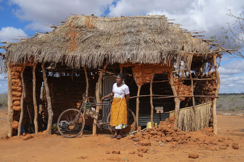 Salama Masha, a former follower of extremist evangelical leader Paul Mackenzie, stands outside a makeshift house near the scene where dozens of bodies were found in shallow graves in the village of Shakahola, near the coastal city of Malindi, in southern Kenya, on Thursday, Sept. 5, 2024. (AP Photo/Brian Inganga)