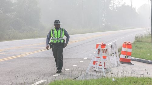 Haze from the BioLab plant chemical fire in Conyers envelops the intersection of Sigman and Rockbridge roads on the morning of Monday, Sept. 30, 2024. (John Spink/AJC)