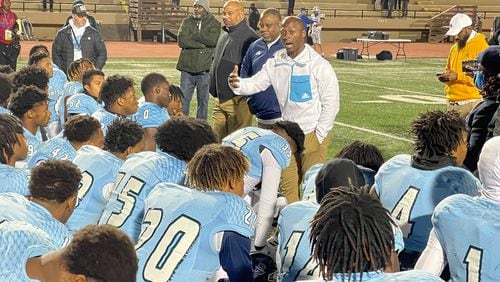 Cedar Grove coach John Adams talks to his team after its 23-0 win over Oconee County in the Class 3A semifinals.