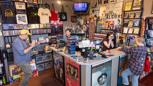 People interact at video rental store Videodrome in Atlanta on Thursday, June 22, 2023. (Arvin Temkar / arvin.temkar@ajc.com)