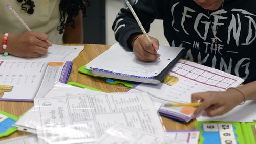 Georgia students were tested on new math standards for the first time this year. In most grades, more students scored proficient or higher compared to last year. (Natrice Miller/AJC)