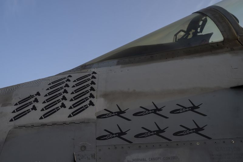 FILE - Drawings of drones and missiles that have been shot down are painted on the fuselage of a fighter jet stationed on the USS Dwight D. Eisenhower in the Red Sea on Tuesday, June 11, 2024. (AP Photo/Bernat Armangue, File)