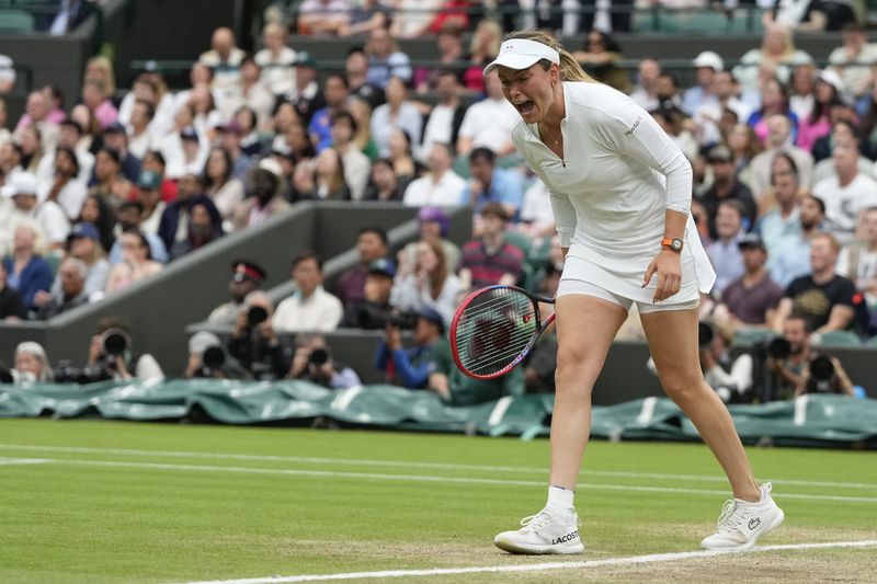Donna Vekic of Croatia reacts during her quarterfinal match against Lulu Sun of New Zealand at the Wimbledon tennis championships in London, Tuesday, July 9, 2024. (AP Photo/Kirsty Wigglesworth)