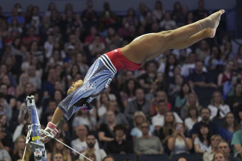 Jordan Chiles competes on the uneven bars at the United States Gymnastics Olympic Trials on Friday, June 28, 2024 in Minneapolis. (AP Photo/Abbie Parr)