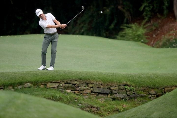 April 10, 2021, Augusta: Justin Thomas chips over the tributary to Rae’s Creek on the thirteenth hole during the third round of the Masters at Augusta National Golf Club on Saturday, April 10, 2021, in Augusta. Curtis Compton/ccompton@ajc.com