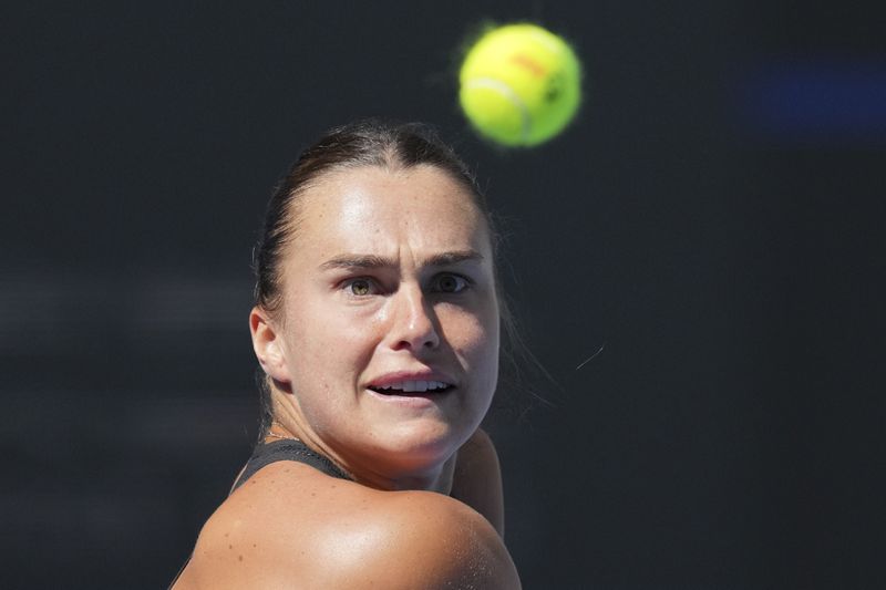 Aryna Sabalenka of Belarus returns a shot from Madison Keys of the United States during their women's singles match of the China Open tennis tournament, at the National Tennis Center in Beijing, Wednesday, Oct. 2, 2024. (AP Photo/Achmad Ibrahim)