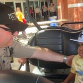 4-year-old Armon is given a sheriff pin by one of the Muscogee County sheriff's deputies. (Photo Courtesy of Bea Lunardini)