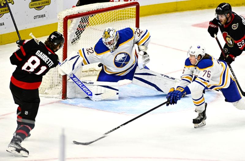 Ottawa Senators' Adam Gaudette (81) scores against Buffalo Sabres goaltender Felix Sandstrom (32) during third-period preseason NHL hockey game action in Ottawa, Ontario, Thursday, Sept. 26, 2024. (Justin Tang/The Canadian Press via AP)