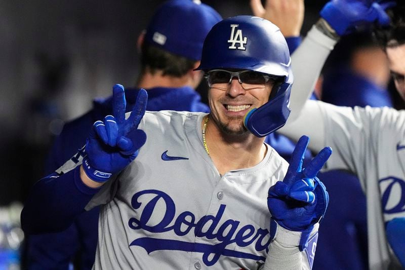 Los Angeles Dodgers' Kike Hernández (8) flashes a smiles after hitting a three-run home run during the fourth inning of a baseball game against the Miami Marlins, Wednesday, Sept. 18, 2024, in Miami. (AP Photo/Marta Lavandier)