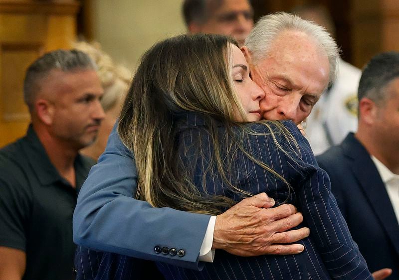 Karen Read gets a long hug from her dad William before the jury breaks for lunch at Norfolk Superior Court in Dedham, Mass., Wednesday June 26, 2024. (Greg Derr/The Patriot Ledger via AP, Pool)