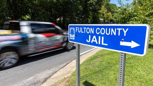Views of a sign pointing to the public entrance of the Fulton County Jail in Atlanta on Wednesday, August 16, 2023, two days after former President Donald Trump and 18 others were indicted for trying to overthrow the 2020 Georgia election. (Arvin Temkar / arvin.temkar@ajc.com)