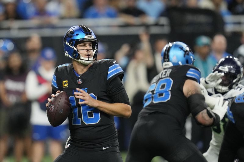 Detroit Lions quarterback Jared Goff looks to pass during the first half of an NFL football game against the Seattle Seahawks, Monday, Sept. 30, 2024, in Detroit. (AP Photo/Paul Sancya)