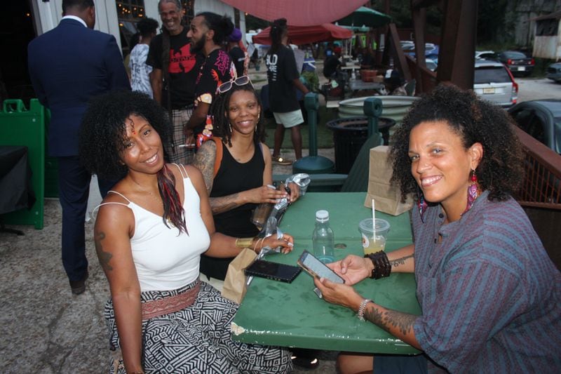 Ladies smile while attending the Vegan Social event in East Point, Ga.