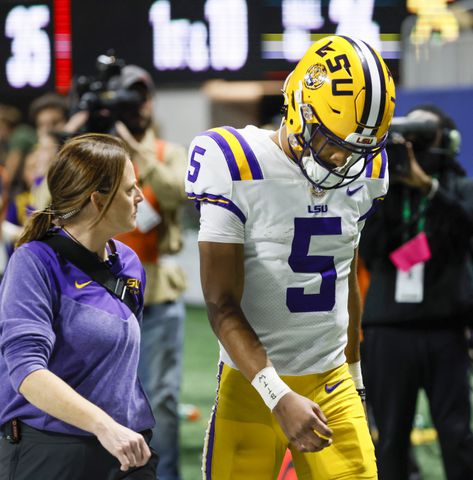 LSU Tigers quarterback Jayden Daniels (5) walks from the field during the second half of the SEC Championship Game against the Georgia Bulldogs at Mercedes-Benz Stadium in Atlanta on Saturday, Dec. 3, 2022. (Bob Andres / Bob Andres for the Atlanta Constitution)
